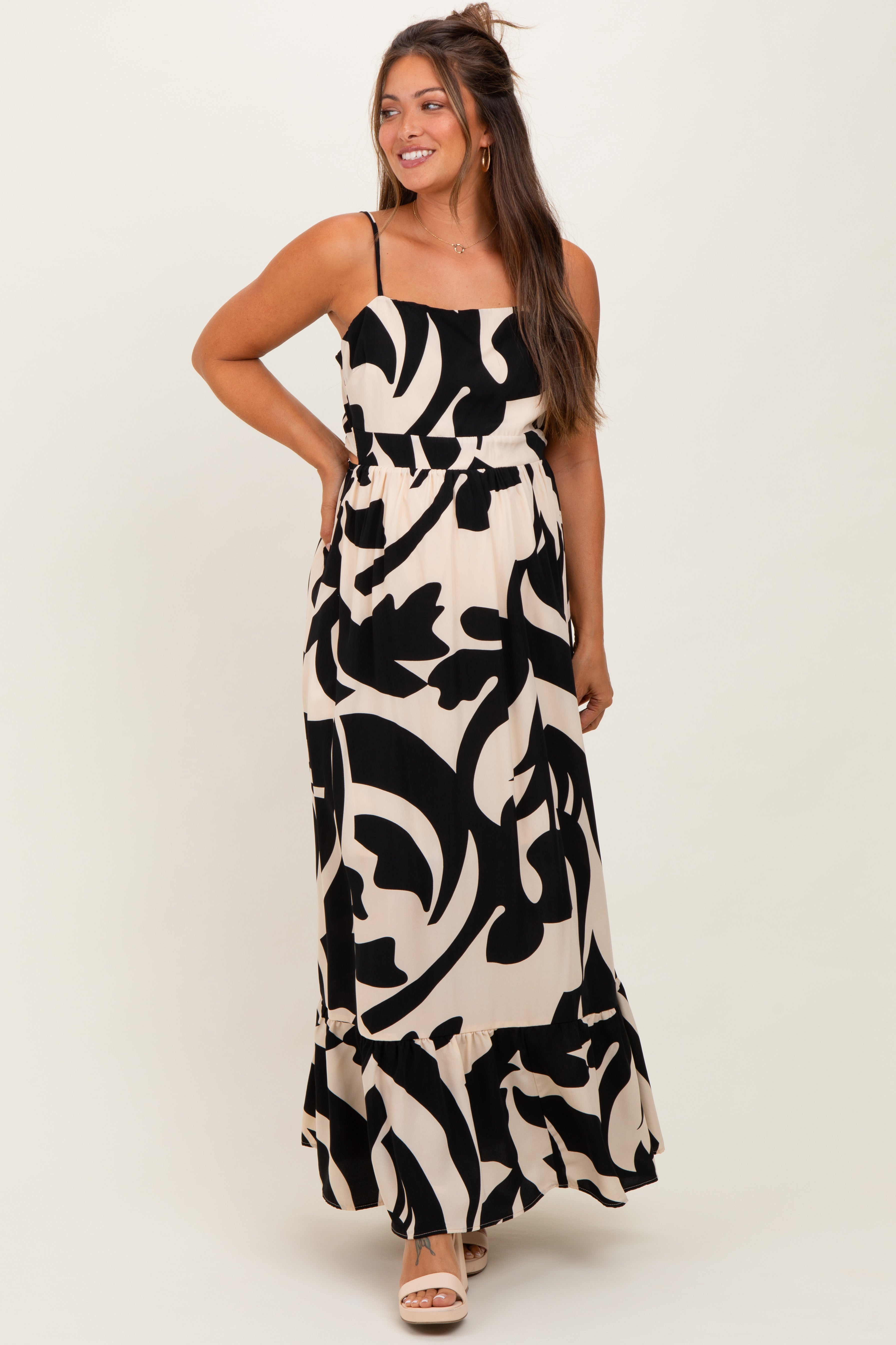 Schwarzes ärmelloses Umstands-Maxikleid mit Print, Cut-outs und Bindeband am Rücken