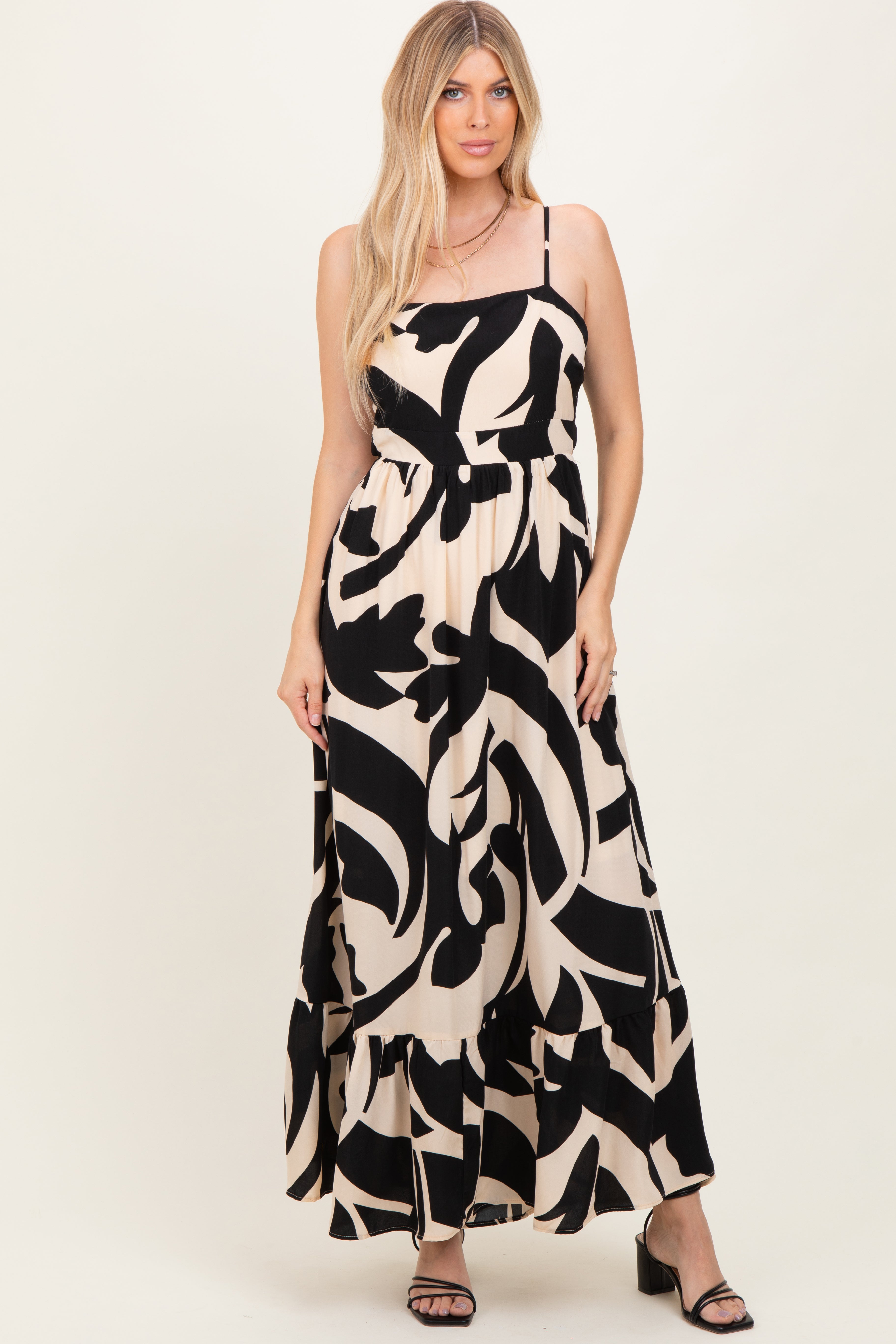 Schwarzes ärmelloses Umstands-Maxikleid mit Print, Cut-outs und Bindeband am Rücken