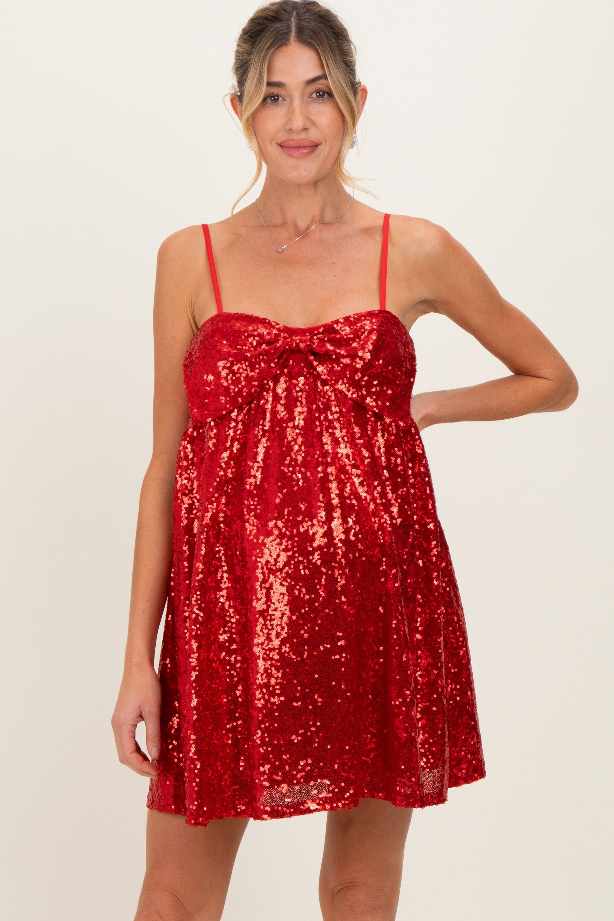 Ärmelloses Umstands-Minikleid mit Pailletten und Schleife vorne