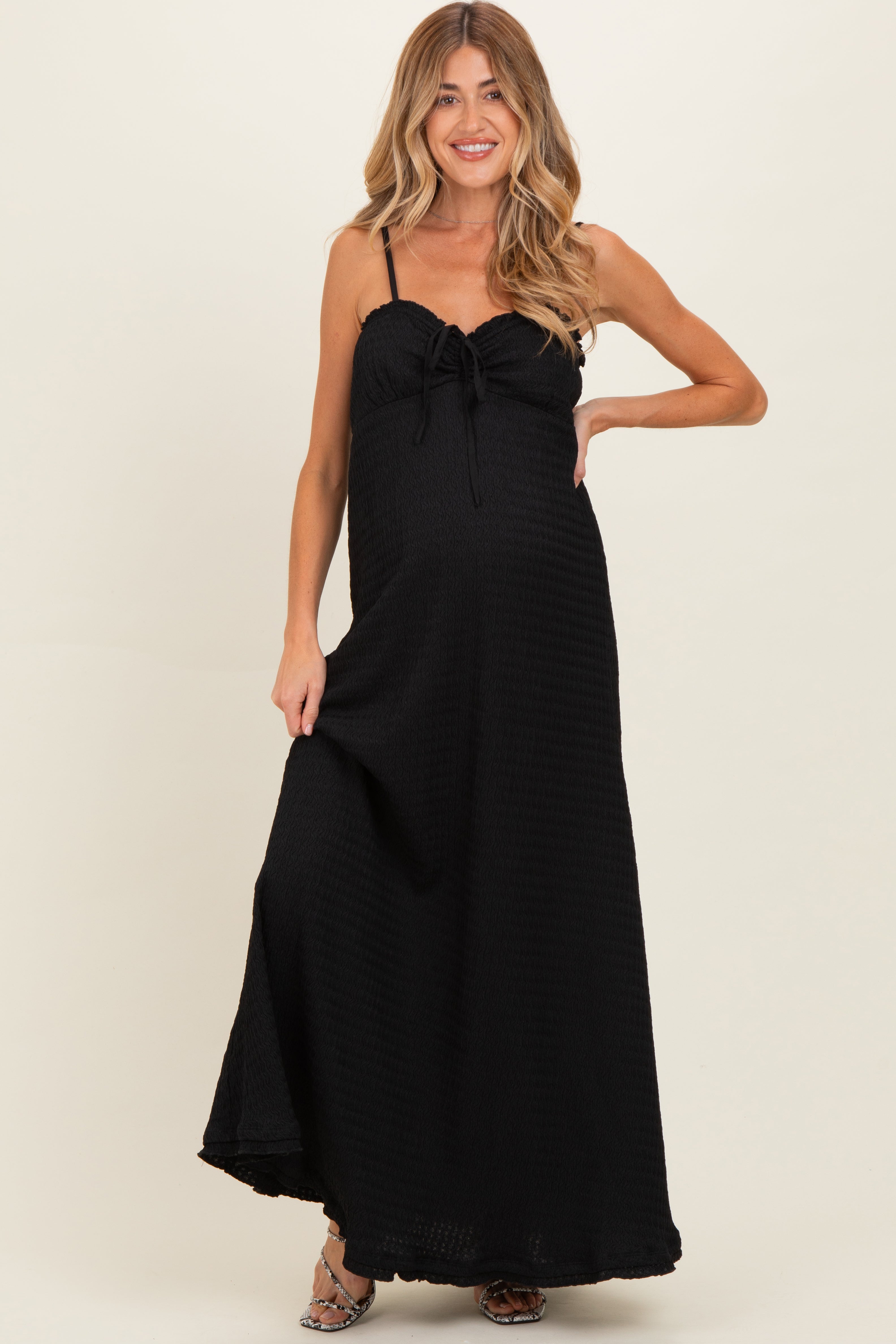 Schwarzes ärmelloses Umstands-Maxikleid aus Waffelstrick mit Herzausschnitt