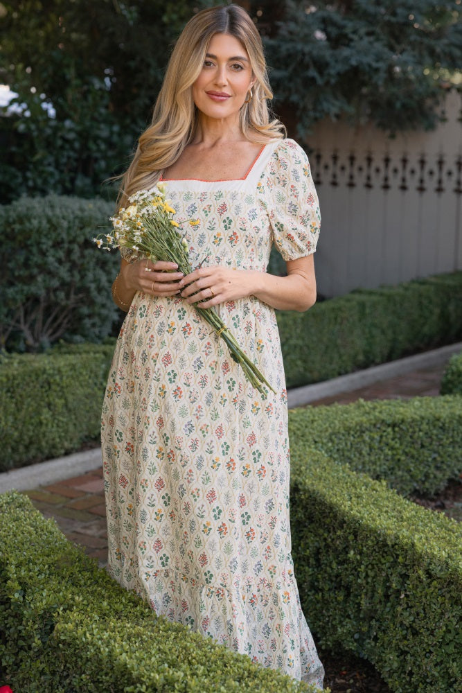 Umstandsmaxikleid aus Baumwolle mit Blumenmuster und Puffärmeln in Creme