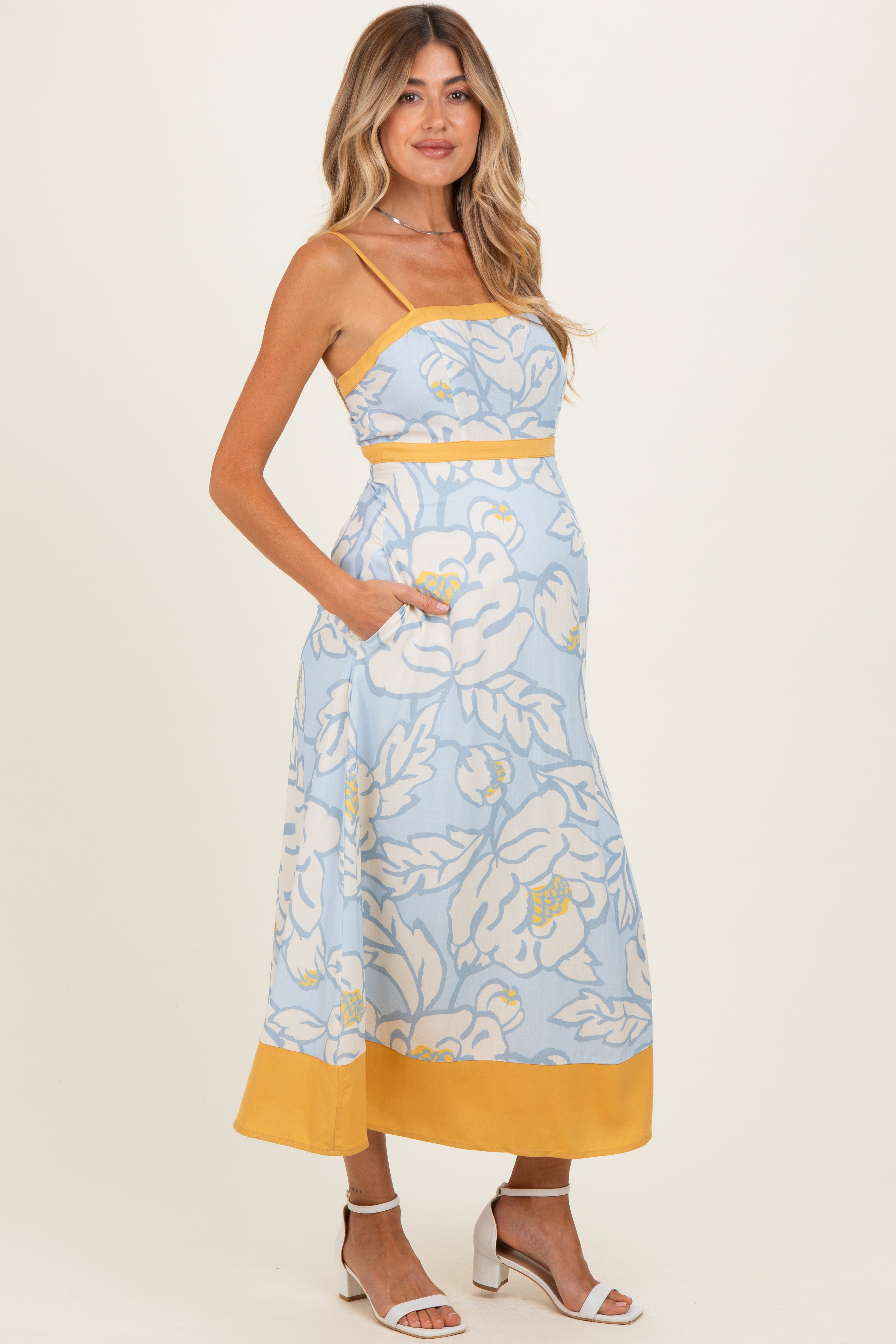 Ärmelloses fließendes Umstands-Maxikleid mit Blumenmuster