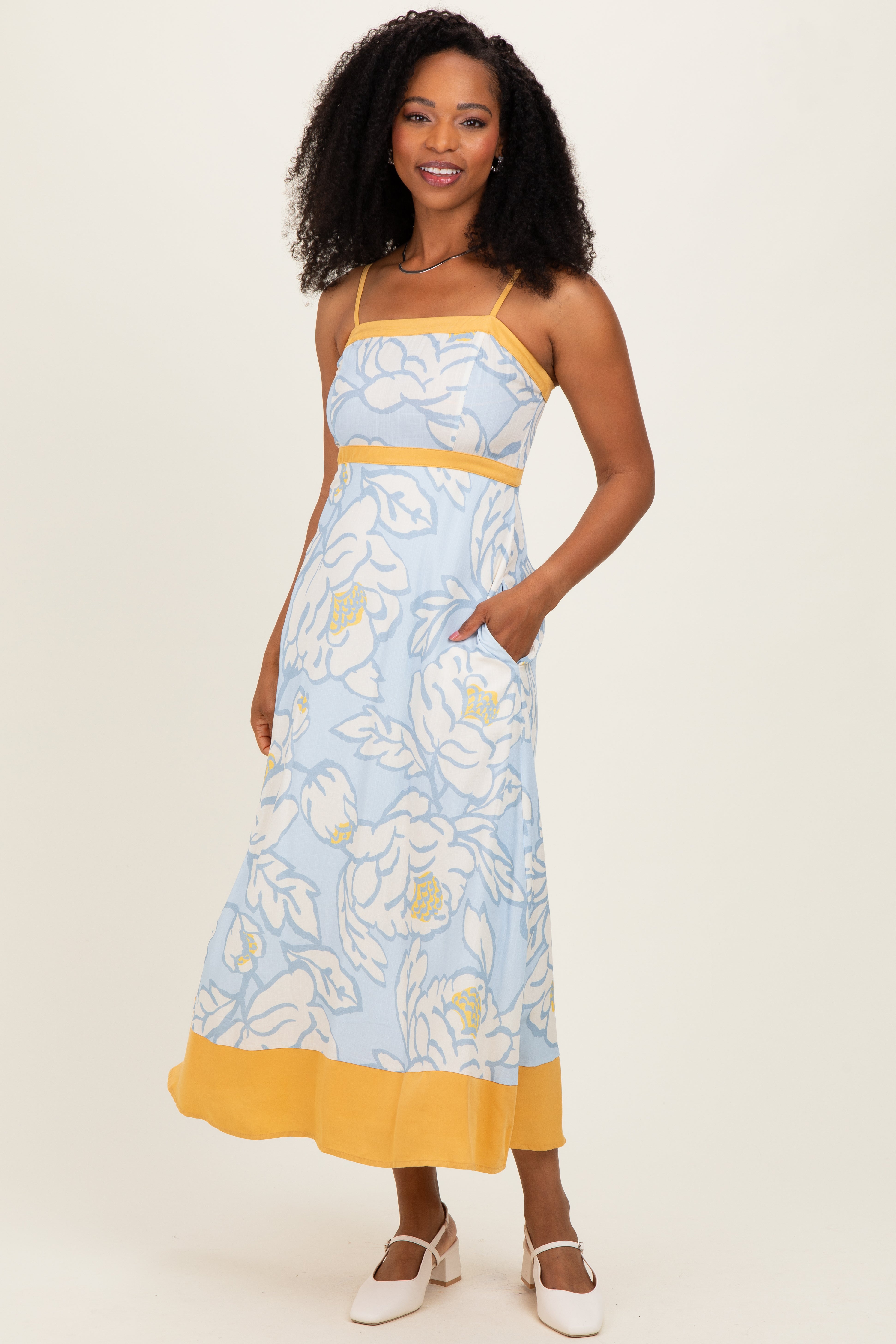 Ärmelloses fließendes Umstands-Maxikleid mit Blumenmuster