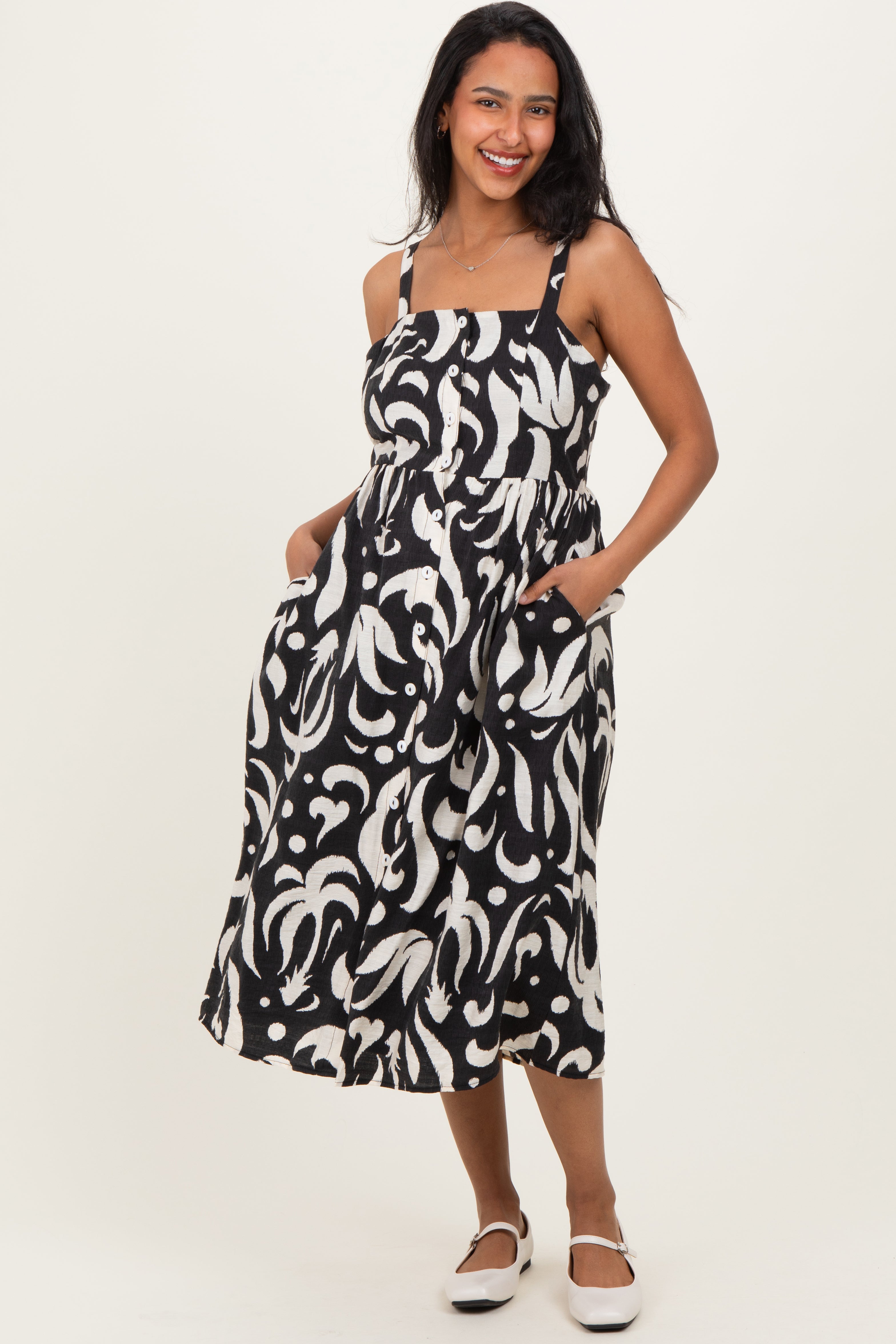 Ärmelloses Umstands-Midikleid mit Print und Knopfleiste in Schwarz