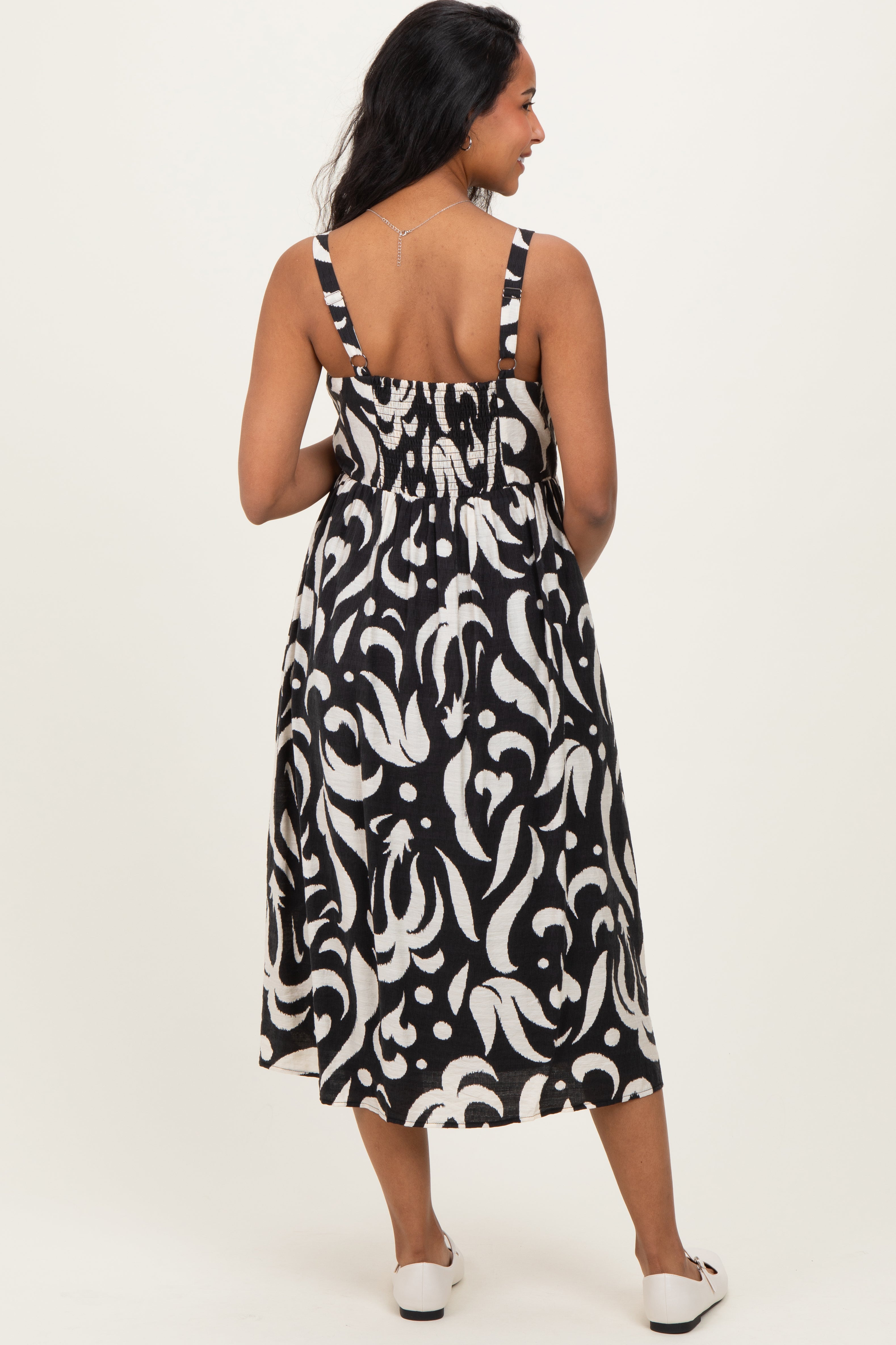 Ärmelloses Umstands-Midikleid mit Print und Knopfleiste in Schwarz