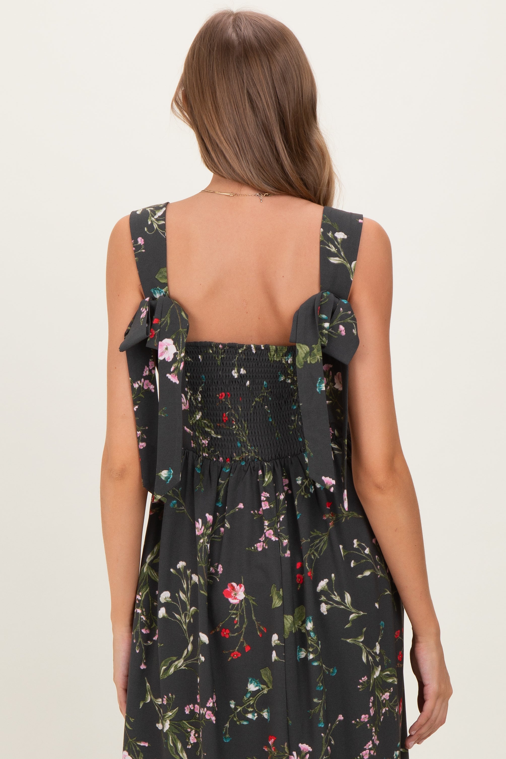 Umstandsmaxikleid in Waldgrün mit Blumenmuster und Schleifenträgern