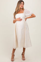 Umstands-Midikleid in Creme mit floraler Stickerei und Puffärmeln