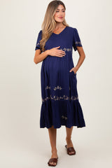 Umstands-Midikleid in Marineblau mit floraler Spitze