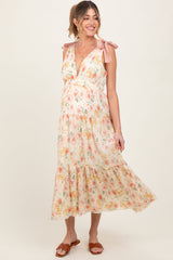 Cremefarbenes Umstands-Maxikleid mit Blumenmuster, Schulterbändern, tiefem V-Ausschnitt und Stufenrock