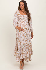 Umstands-Maxikleid mit Blumenmuster, Smok-Detail und Zipfelsaum