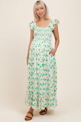 Grünes Umstands-Maxikleid mit Blumenmuster, Smok-Oberteil und Rüschenärmeln