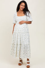 Umstands-Maxikleid mit Blumenmuster, Smok-Oberteil und Volant-Stufenrock