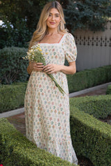 Umstandsmaxikleid aus Baumwolle mit Blumenmuster und Puffärmeln in Creme