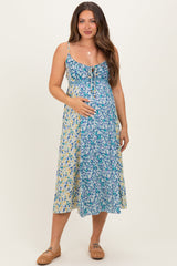 Blaues Umstands-Midikleid mit Blumenmuster und Bindedetail vorne