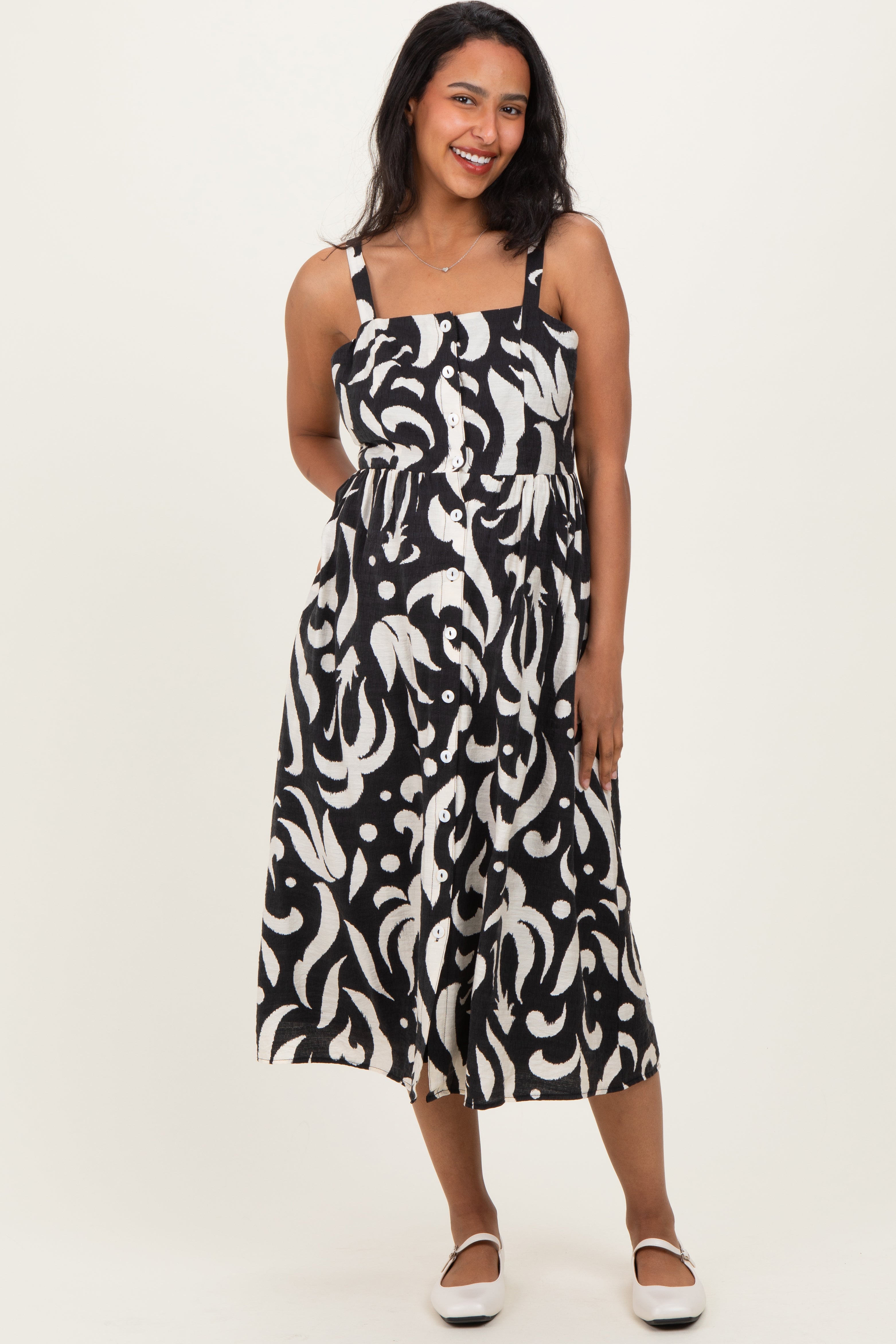 Ärmelloses Umstands-Midikleid mit Print und Knopfleiste in Schwarz