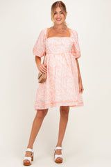 Umstands-Minikleid mit Blumenmuster und Kontrasteinfassung