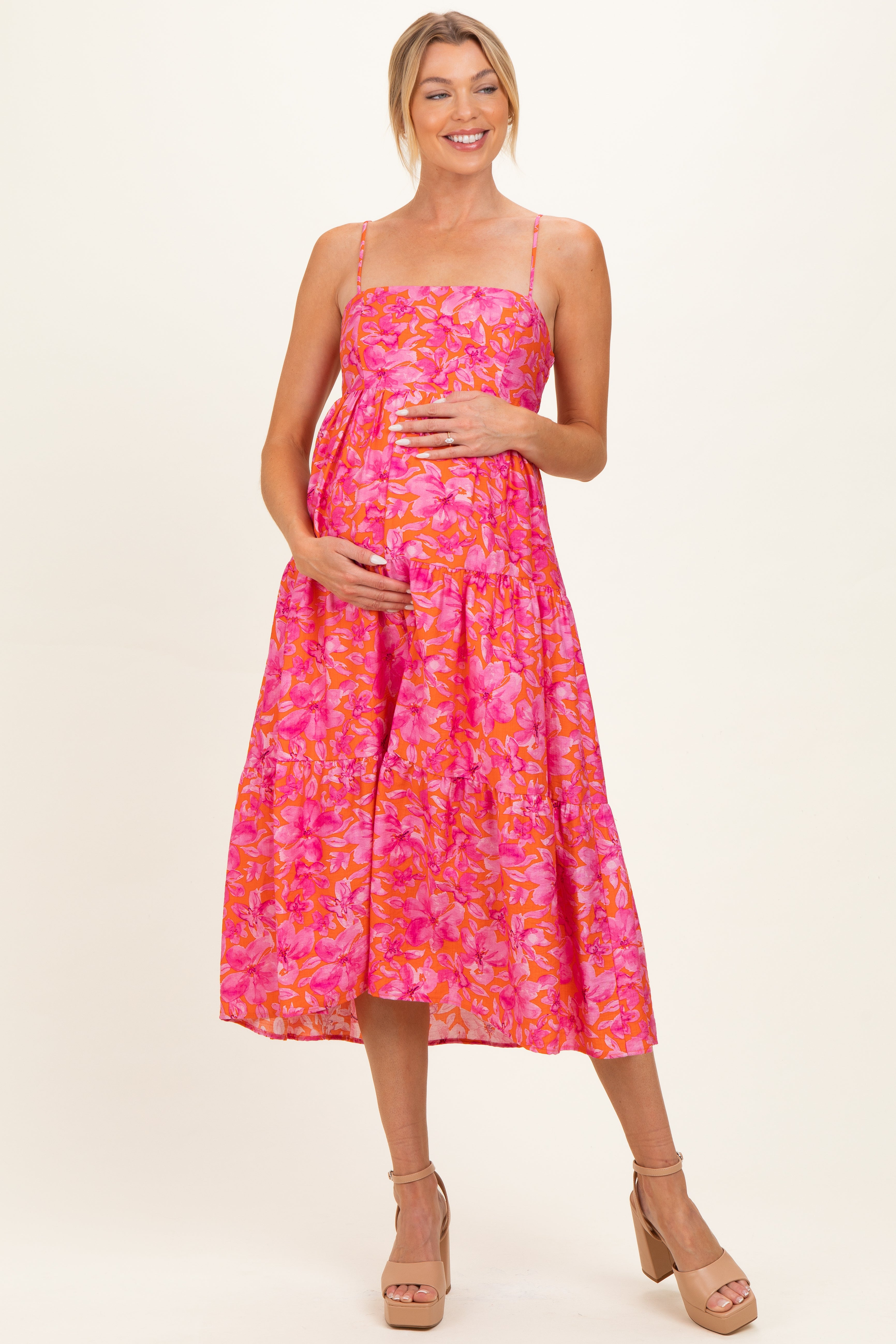 Ärmelloses Umstands-Midikleid in Fuchsia mit Blumenmuster und Stufenrock