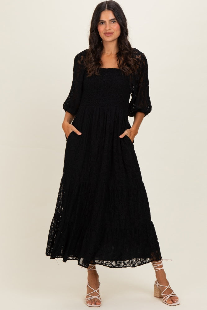 Schwarzes gesmoktes Umstands-Midikleid aus Spitze