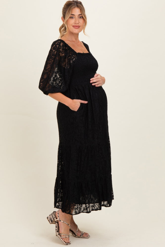 Schwarzes gesmoktes Umstands-Midikleid aus Spitze