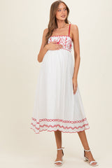 Rotes Umstands-Midikleid mit floraler Stickerei und Wellensaum