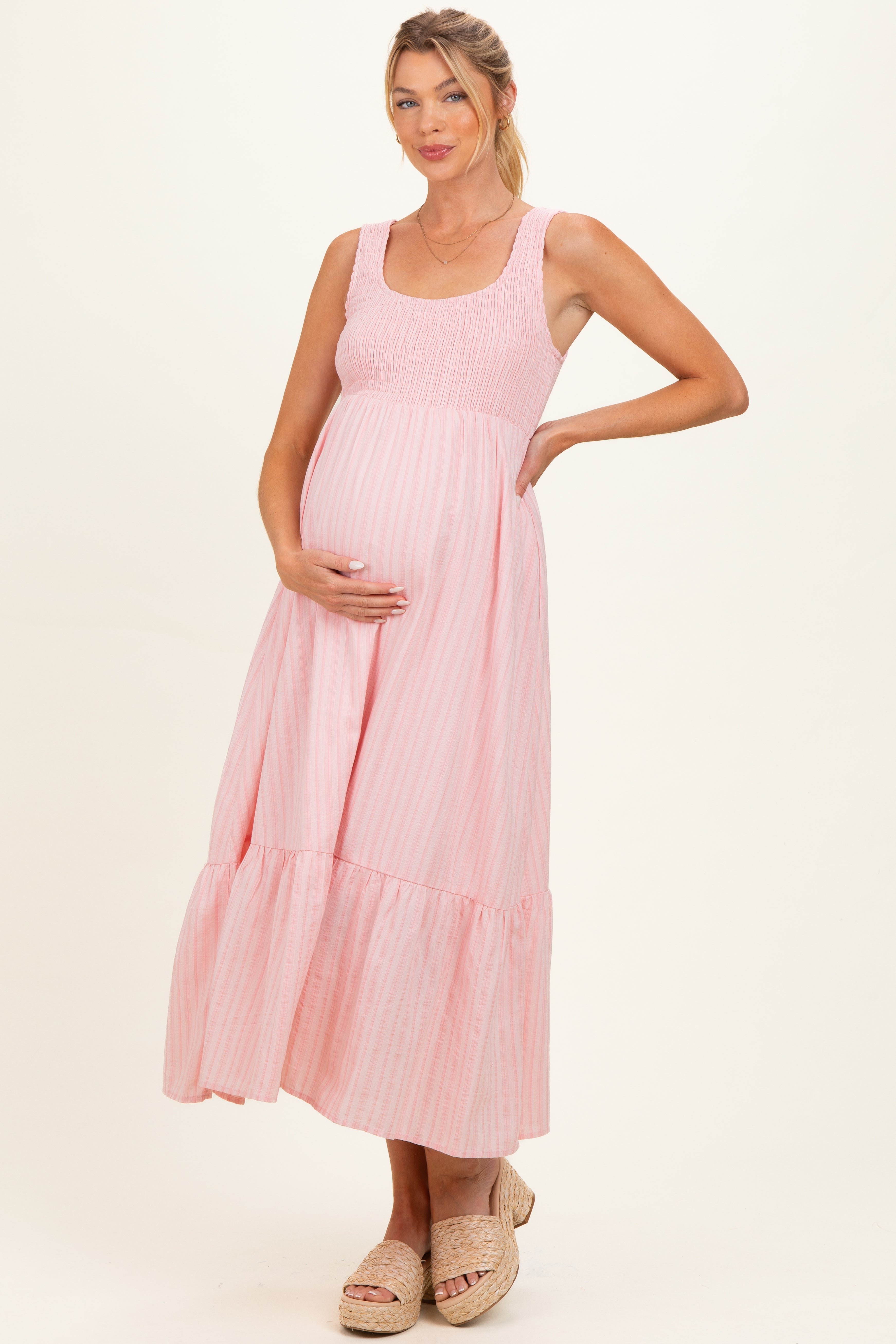 Ärmelloses Umstands-Maxikleid in Rosa mit Smok-Detail und Streifen