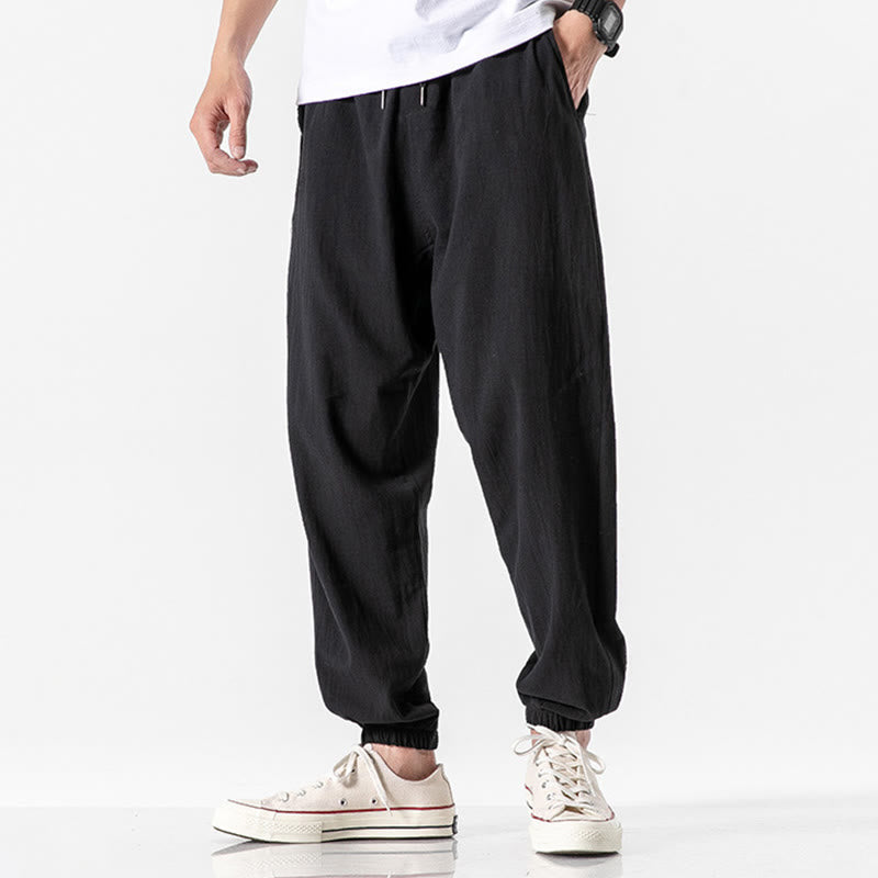 Einfarbige Herrenhose aus Baumwolle mit Kordelzug und Taschen