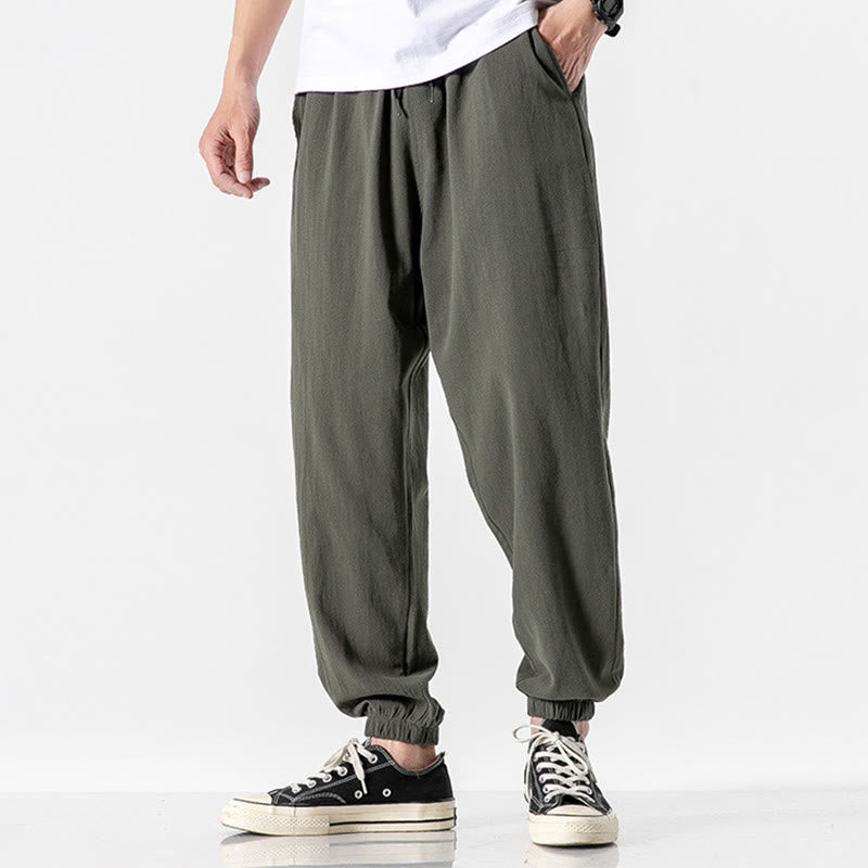 Einfarbige Herrenhose aus Baumwolle mit Kordelzug und Taschen
