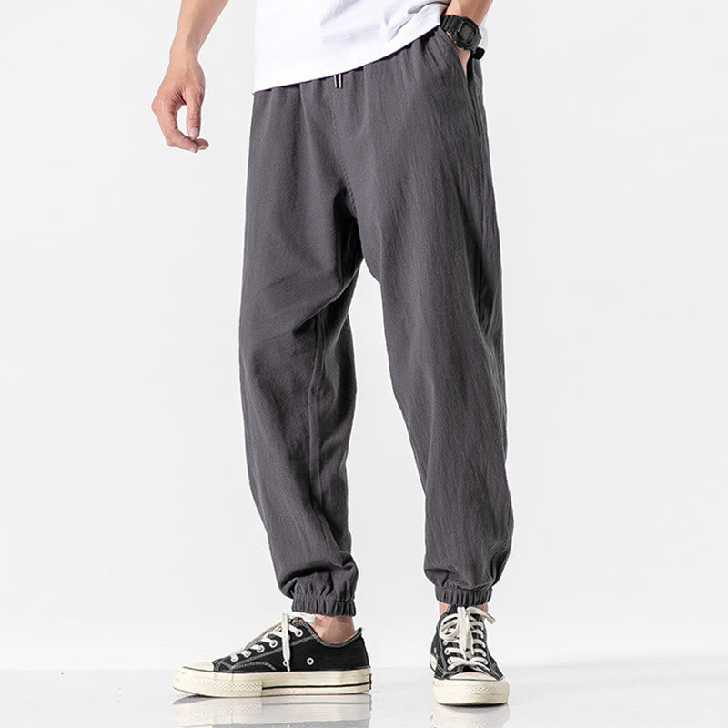 Einfarbige Herrenhose aus Baumwolle mit Kordelzug und Taschen