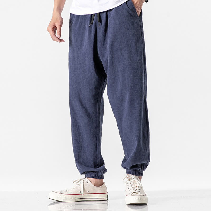 Einfarbige Herrenhose aus Baumwolle mit Kordelzug und Taschen